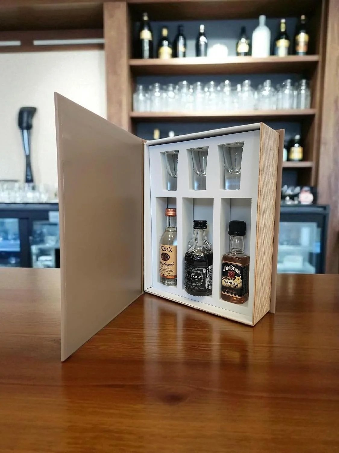 Sipping Between the Lines opened with 3 glasses and mini bottle compartments