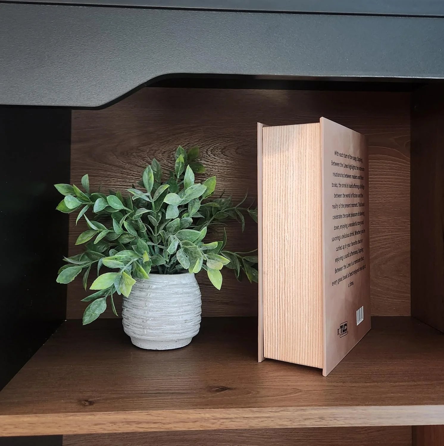 Side view of Sipping Between the Lines displayed on a shelf