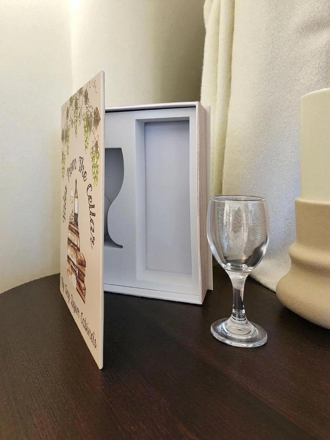 Tales from the Cellar opened beside wine glass