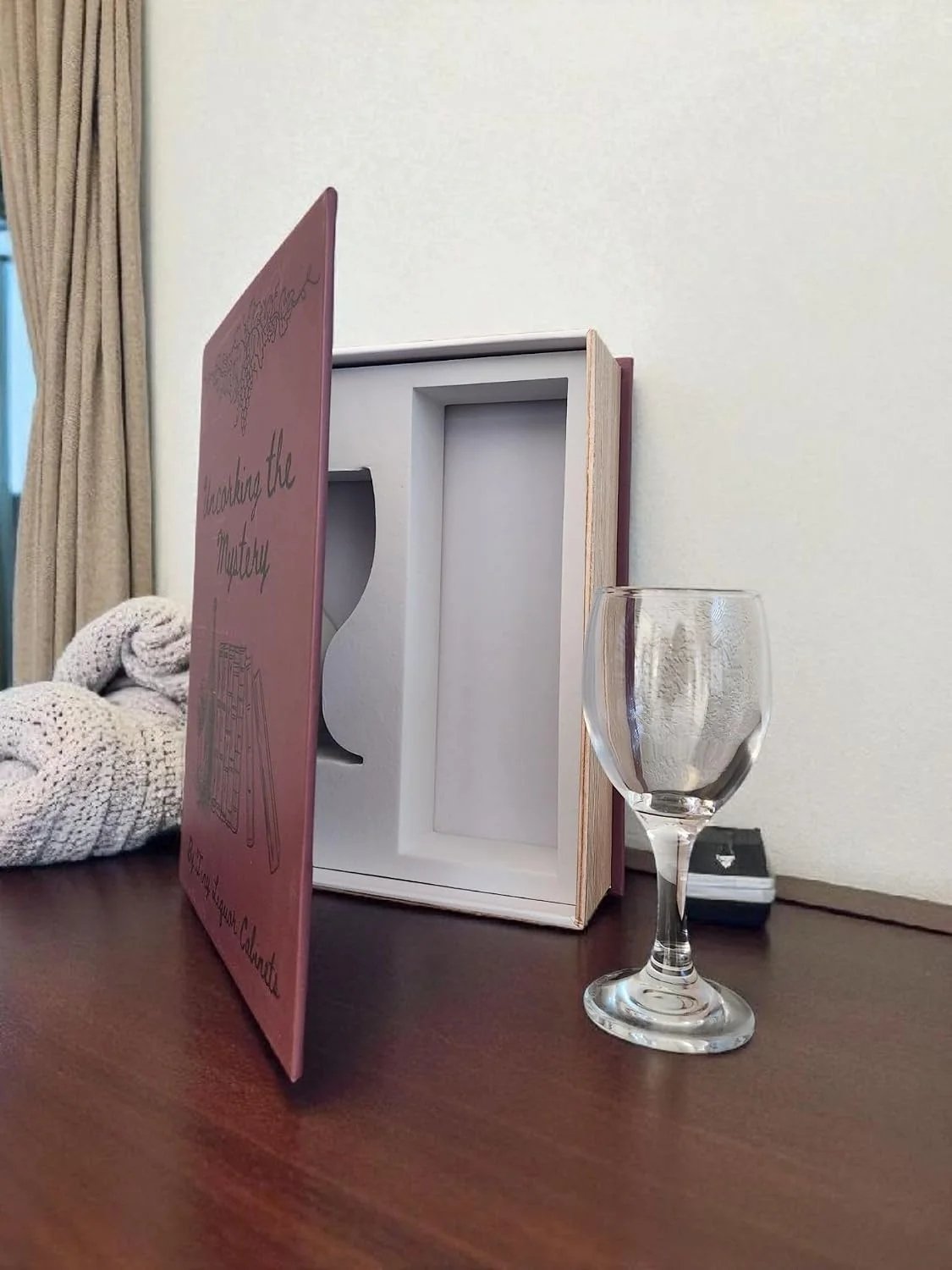 Uncorking the Mystery opened beside wine glass